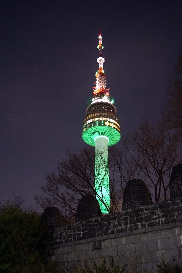 N Seoul Tower illuminated at night on top of Namsan