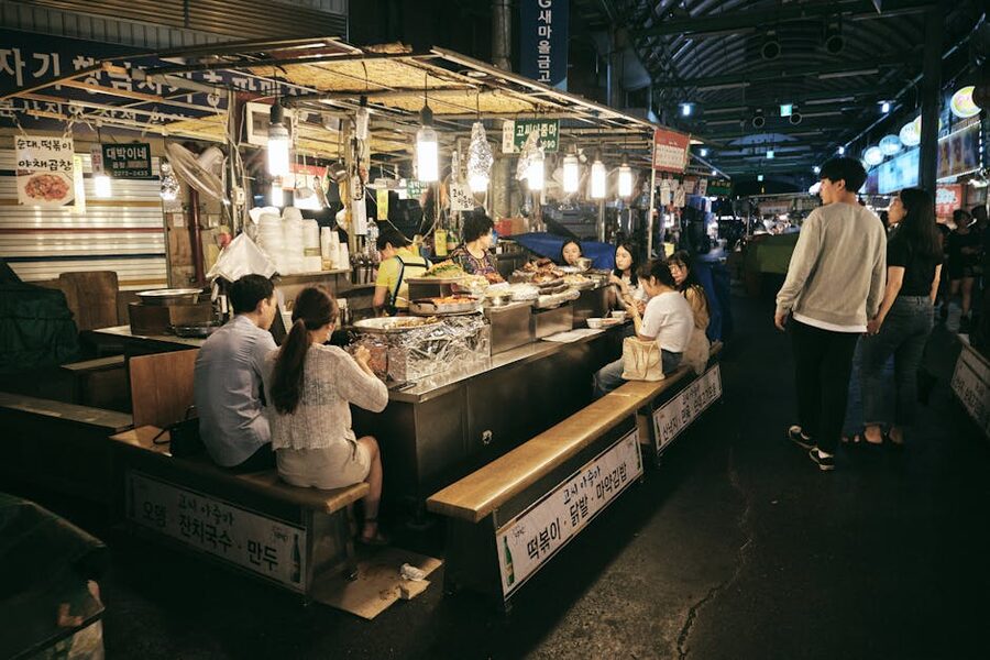Seoul night market with people and street food