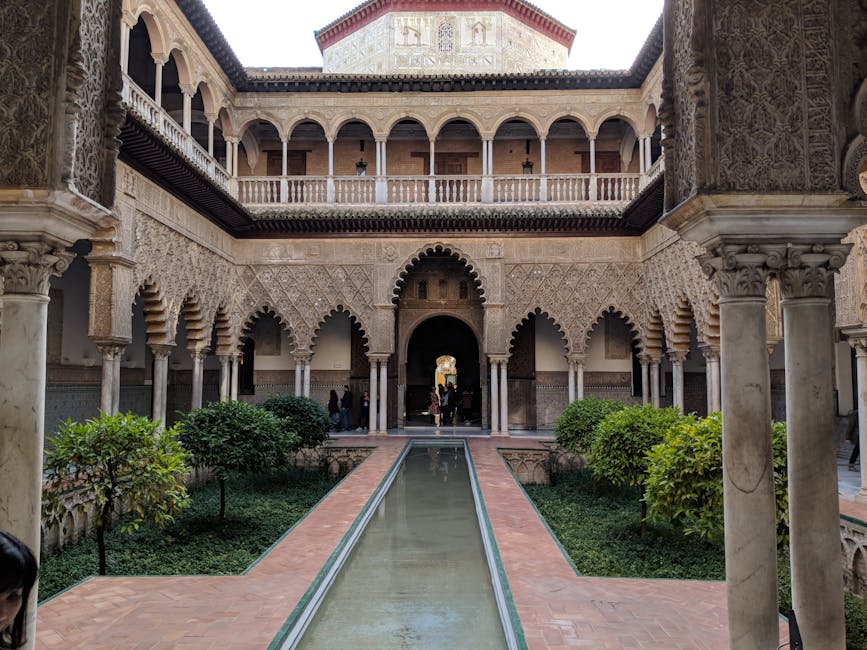 Historic courtyard with Moorish arches at Alcazar of Seville