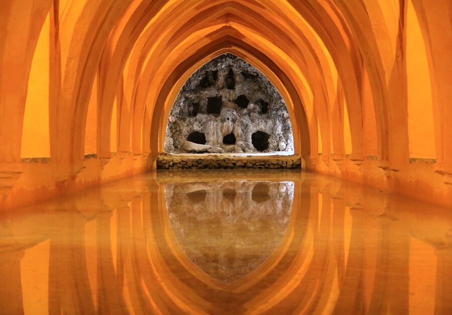 Orange-tinted water at Alcazar Seville