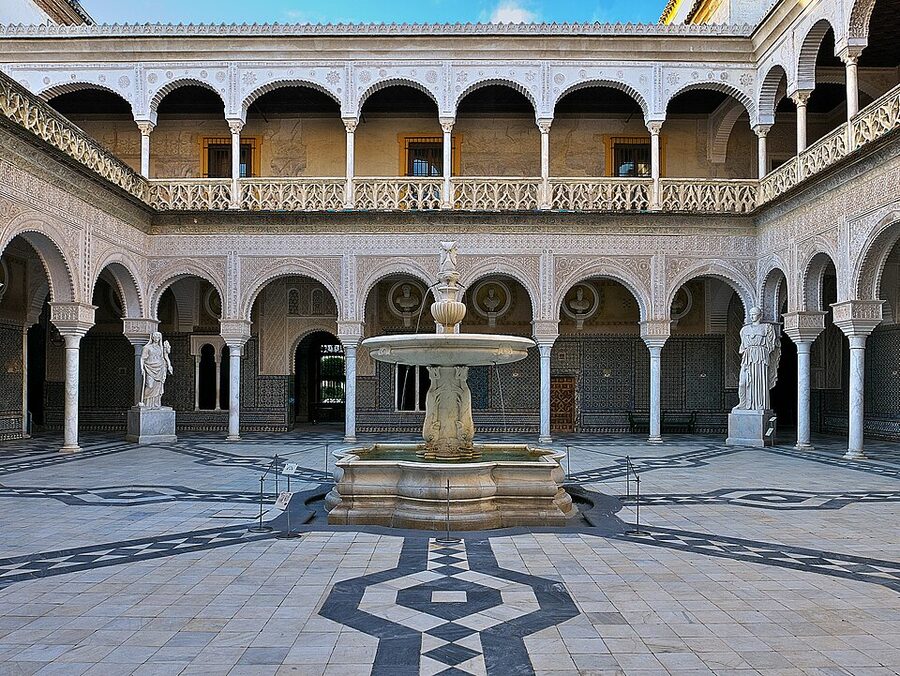 Casa de Pilatos main patio with arches and tilework Seville