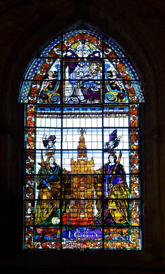 Stained glass window of Justa and Rufina holding the Giralda from 1685