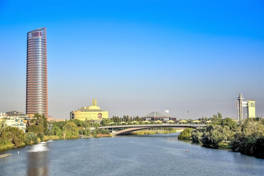 Modern bridge and Torre Sevilla skyscraper Cartuja Seville