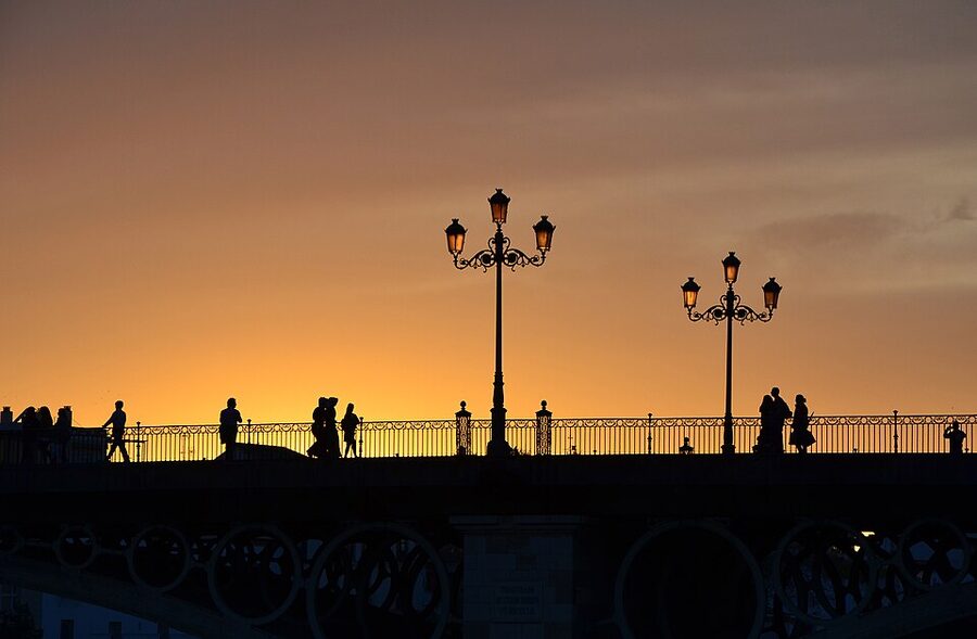 Puente de Triana bridge over the Guadalquivir at evening