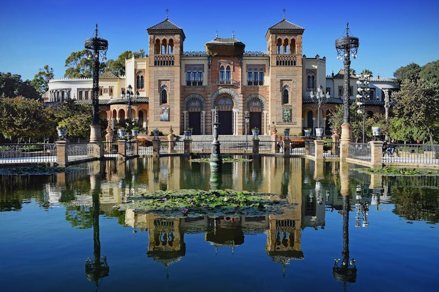 Maria Luisa Park Seville architecture reflecting in the pond
