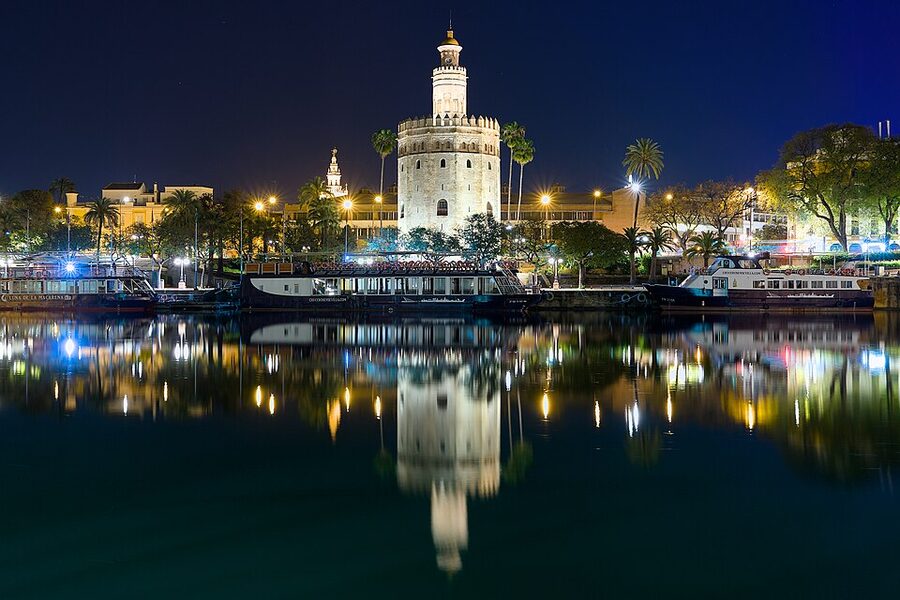 Torre del Oro and Guadalquivir river at night Seville
