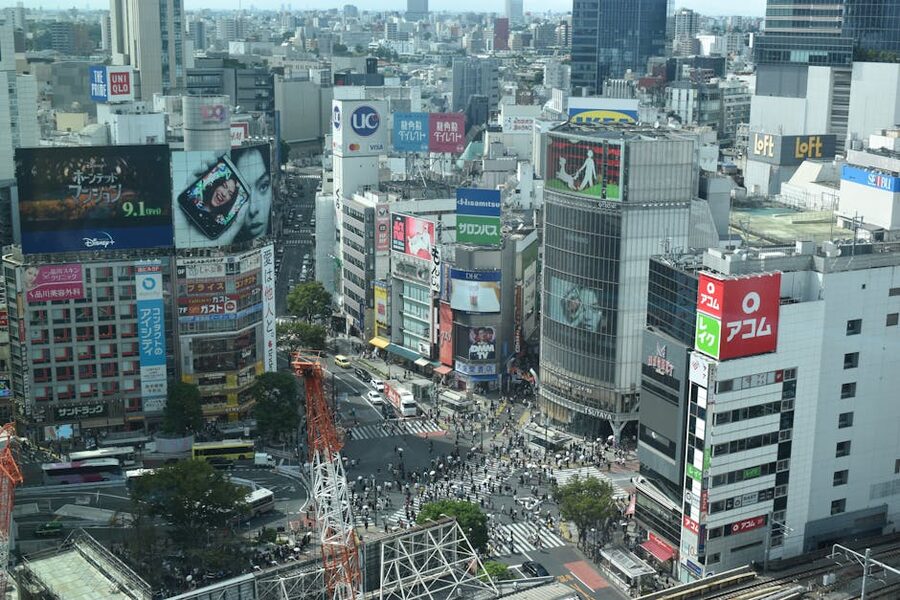 Aerial view of Shibuya Crossing in Tokyo with pedestrians and billboards