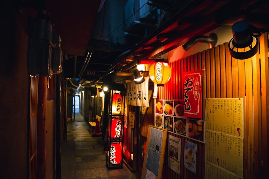 Traditional Japanese izakaya bars with red lanterns in the evening