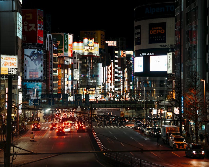 Shinjuku at night with neon lights and traffic
