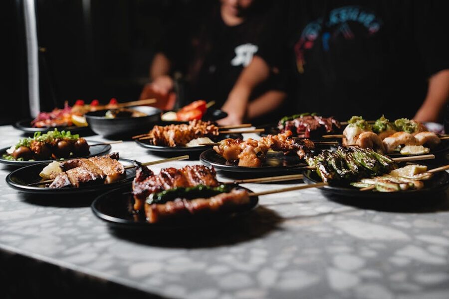Variety of yakitori skewers on plates