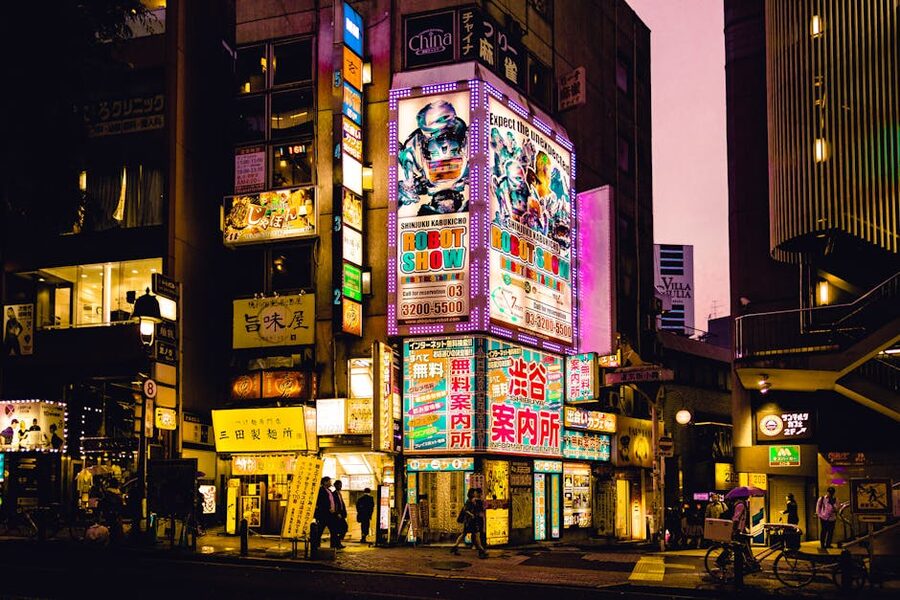 Colorful neon signs illuminating Shinjuku streets at night
