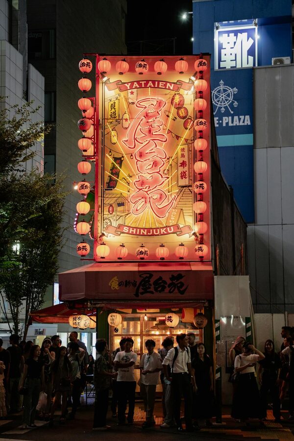 Lively izakaya scene in Shinjuku Tokyo at night