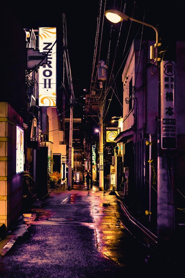 Neon lights and signs on a street in Shinjuku Tokyo at night