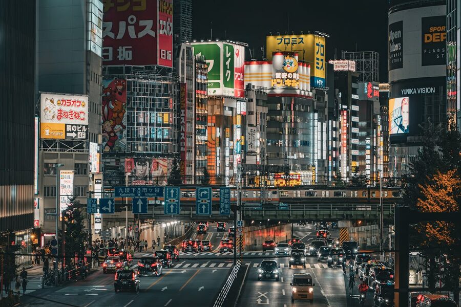 Shinjuku cityscape at night showing neon lights, buildings, and busy streets in Tokyo