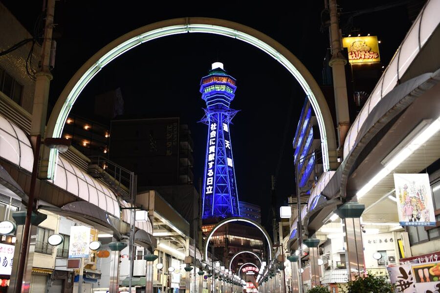 Shinsekai district at night with Tsutenkaku Tower lit up in Osaka