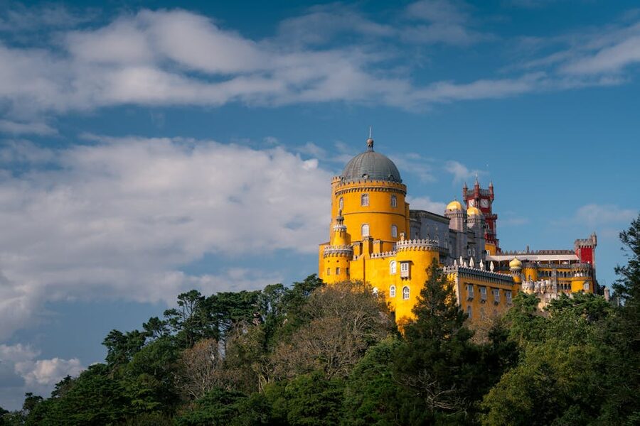 Pena Palace colorful walls under clear blue sky Sintra Portugal