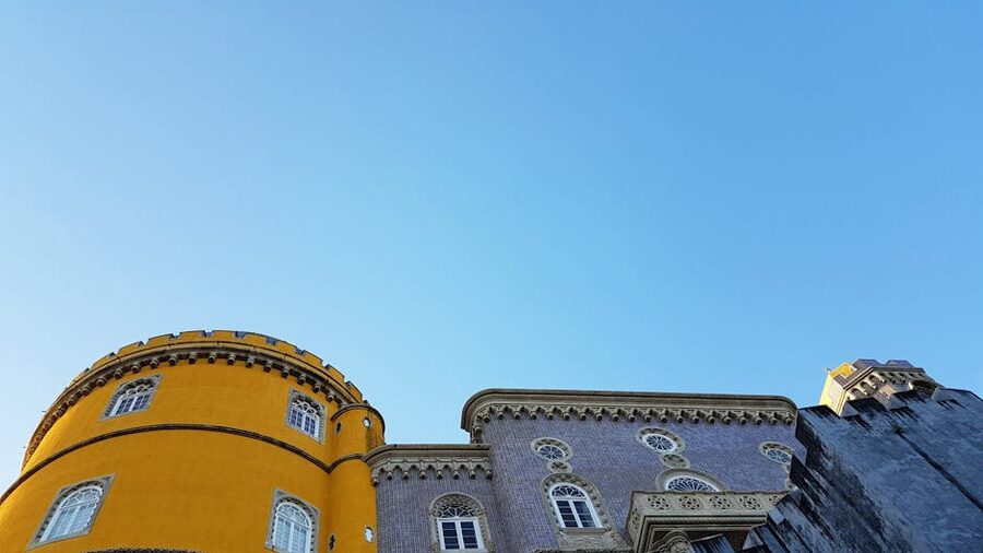 Pena Palace yellow walls and gray towers seen from the south terrace Sintra