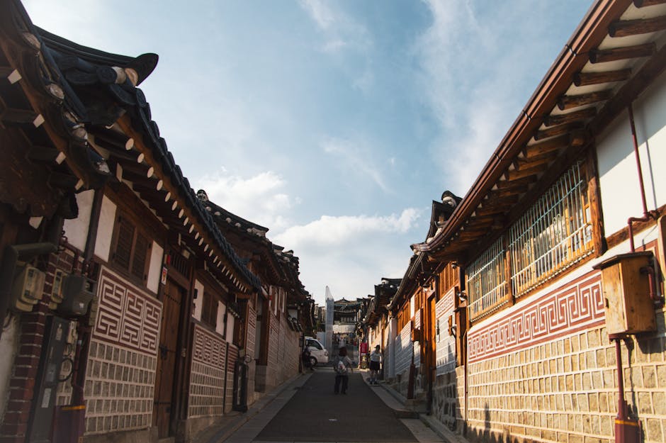 Traditional hanok village street in Seoul under clear sky
