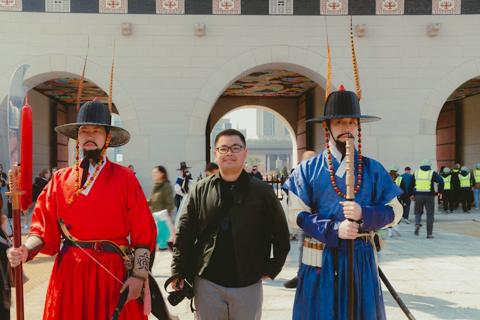 Visitor posing with traditional guards at Gwanghwamun Gate Seoul