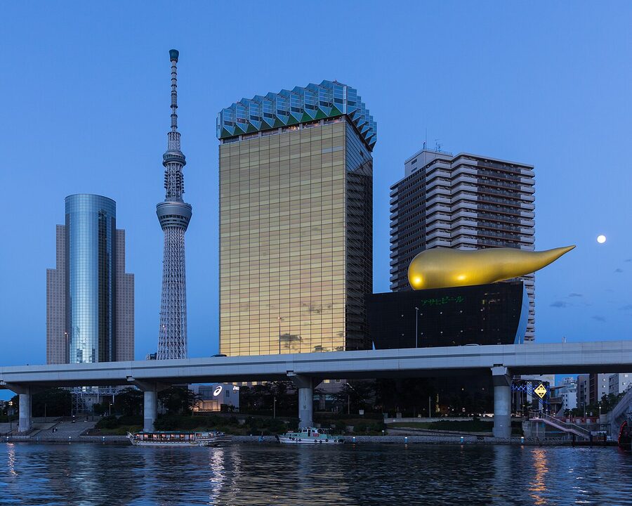 Asahi Breweries headquarters building with Skytree at blue hour in Sumida