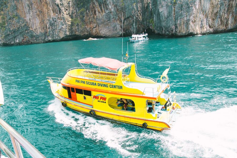 Tour boat in the turquoise waters near Phi Phi Islands Thailand