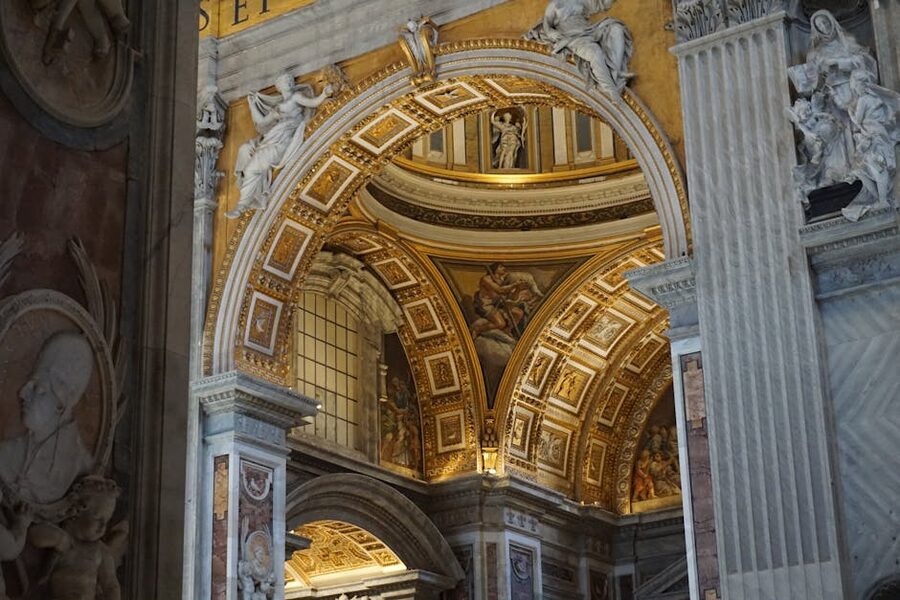Baroque arches and sculptural detail inside St Peter's Basilica