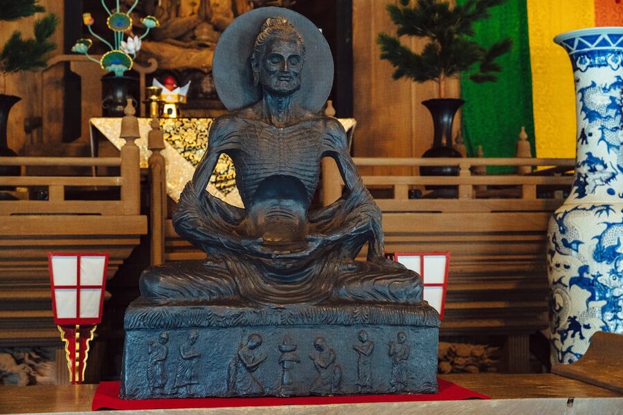Detailed stone statue of a Buddhist figure in Kamakura Japan