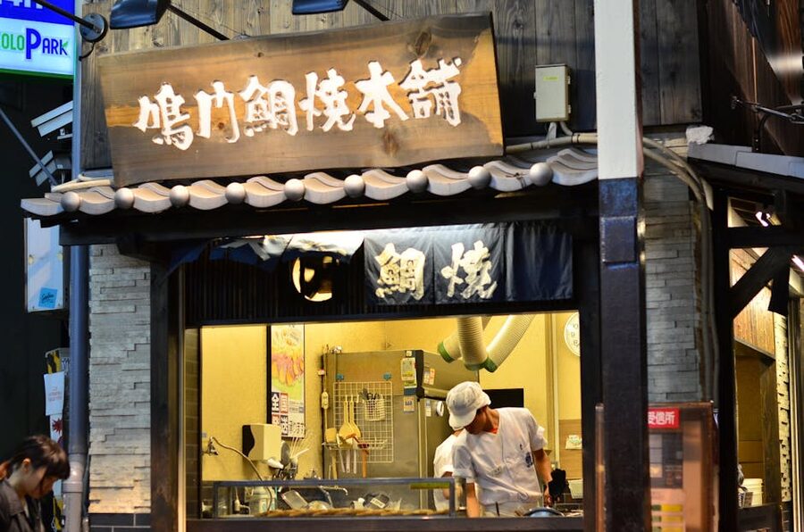 Street vendor preparing food at Osaka stall