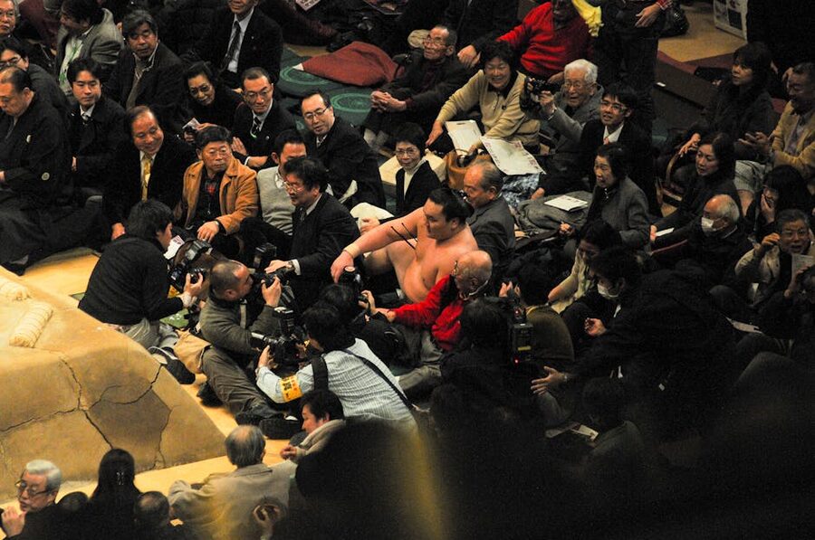 Sumo match with crowd watching in Japan arena