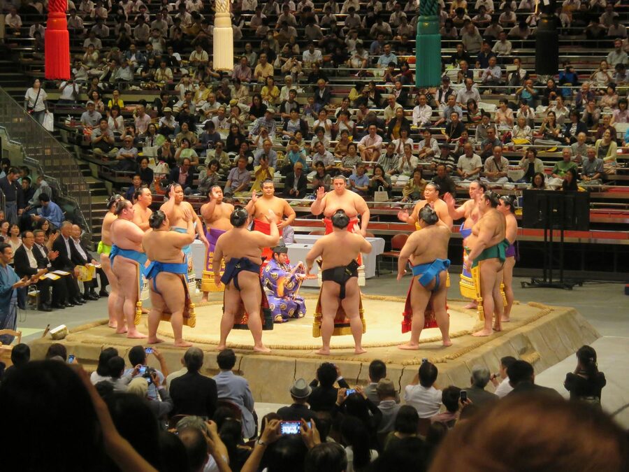 Sumo wrestlers in Tokyo arena traditional match