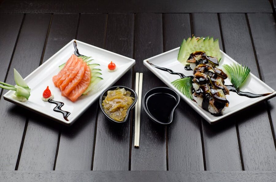 Japanese sushi and sashimi on dark wood