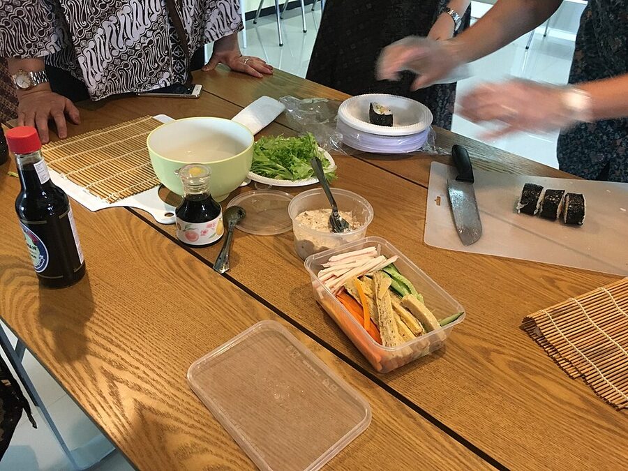 Sushi making process demonstrating rice and nori