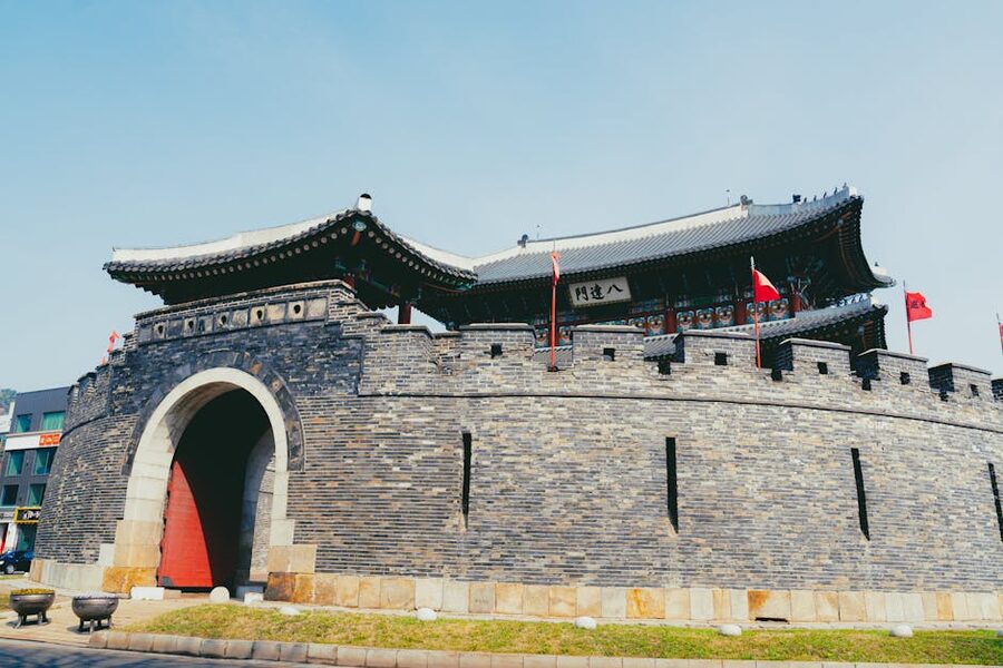 Suwon Hwaseong Fortress wall in sunshine showing traditional Korean architecture