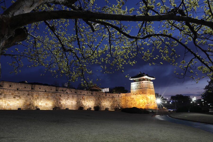 Hwaseong Fortress at magic hour with warm golden light