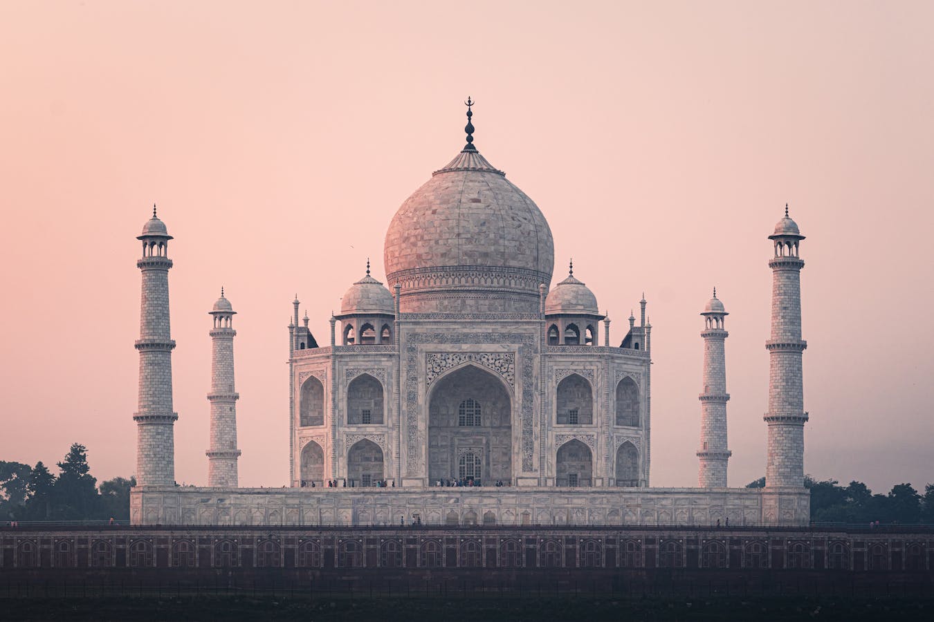 Reflecting pool leading to the Taj Mahal with visitors on the central pathway