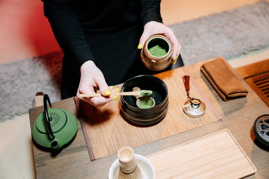 Tea ceremony host pouring hot water