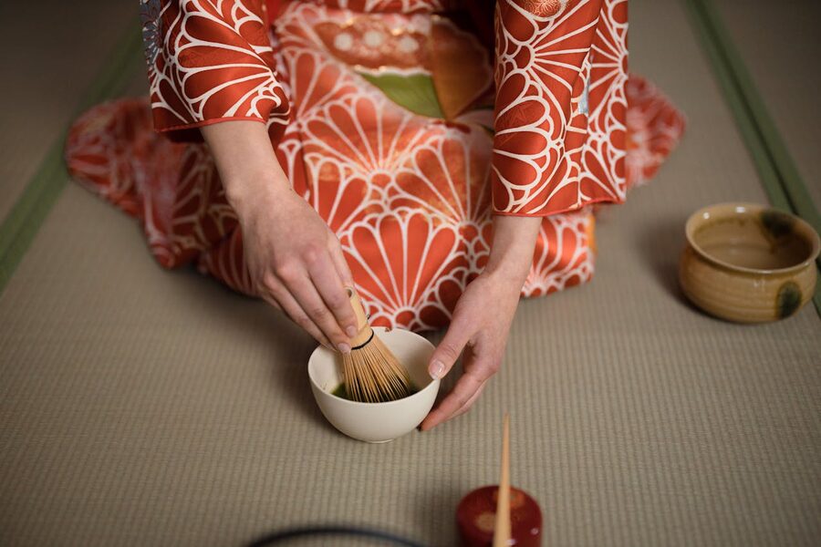 Tea ceremony whisking matcha with bamboo whisk