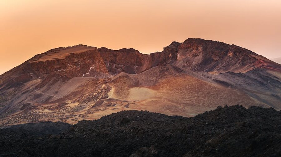 Teide volcano glowing under orange sunset