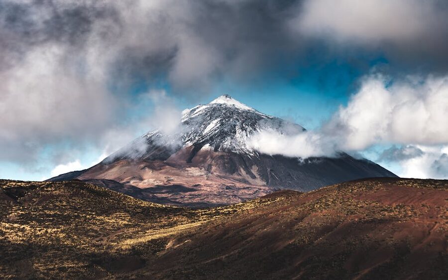 Mount Teide snow-capped peak with drifting clouds