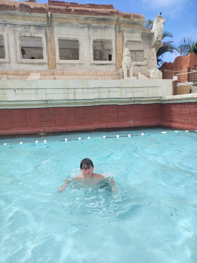 Lazy river with floats and tropical greenery at Siam Park