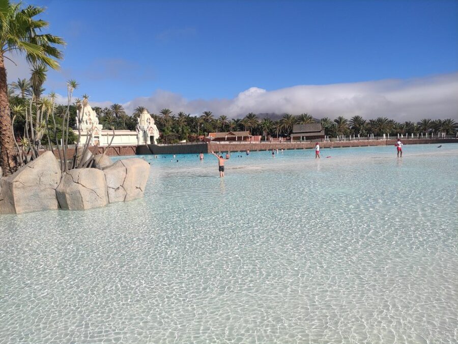 Thai pavilion structures and palm trees at Siam Park Costa Adeje