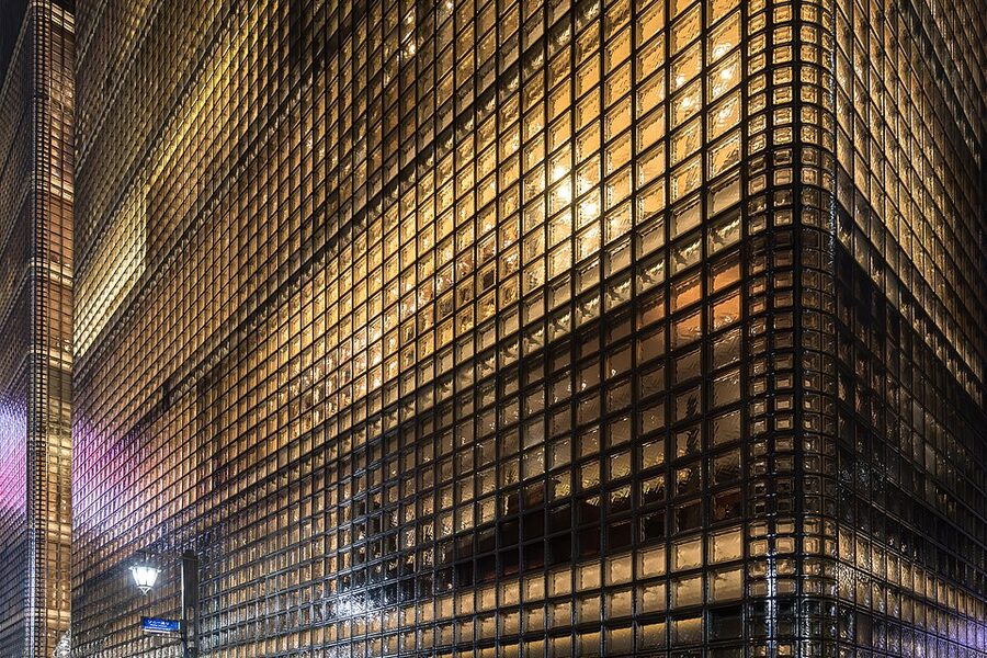 Illuminated Maison Hermes facade in Ginza made of glass blocks