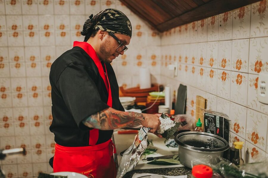 Japanese chef preparing dishes in a professional kitchen