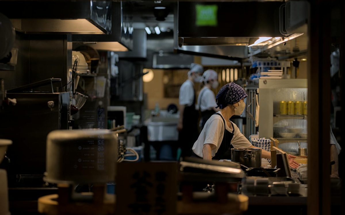 Busy restaurant kitchen in Japan at night