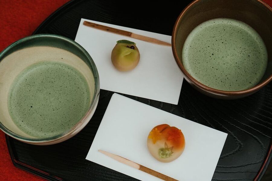 Traditional Japanese tea ceremony setting with matcha and wagashi sweets
