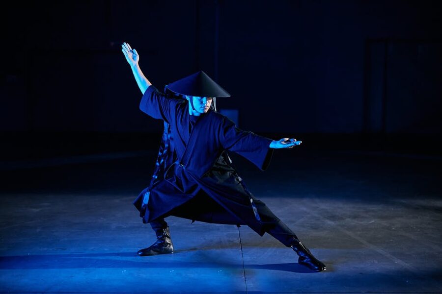 Ninja in traditional attire striking a training stance in Tokyo