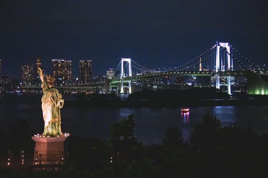 Tokyo night skyline featuring Rainbow Bridge and Odaiba Liberty Statue