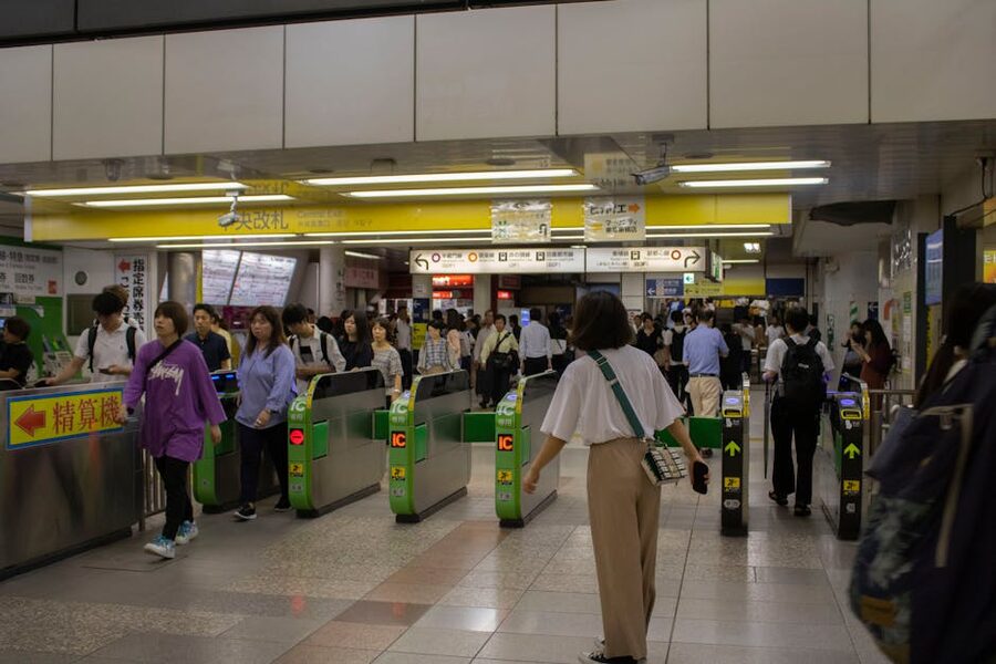 Commuters at a Tokyo subway station entrance