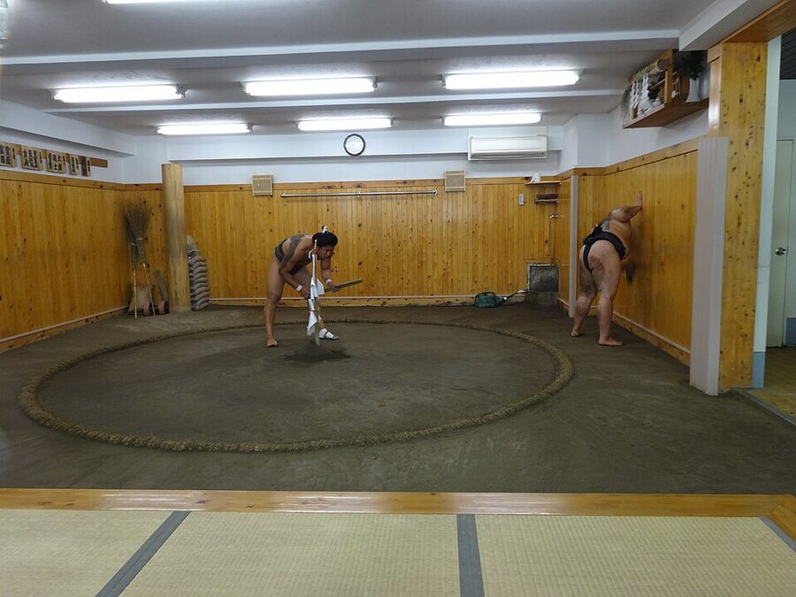 Arranging the dohyo ring soil after Sumo training at Arashio Stable