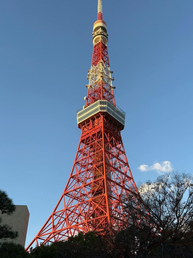 Tokyo Tower standing tall against a clear blue sky in Japan
